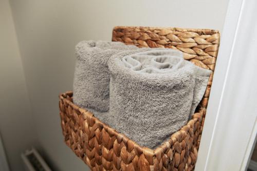 two baskets filled with towels in a room at Pass the Keys Cosy Hideaway in the Countryside in Lincoln