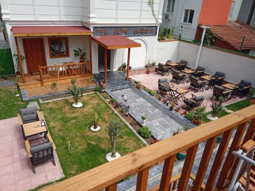 an aerial view of a patio with tables and chairs at My Home Hotel Gulluk in Antalya