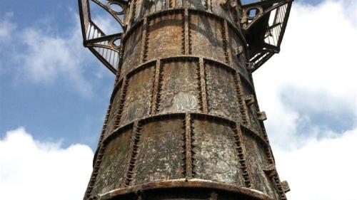 an old rusty pole with the sky in the background at Shambles in Llanmadoc