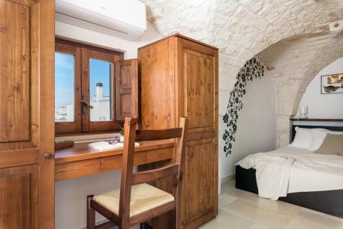 Ένα ή περισσότερα κρεβάτια σε δωμάτιο στο La Terrazza del Professore by Wonderful Italy