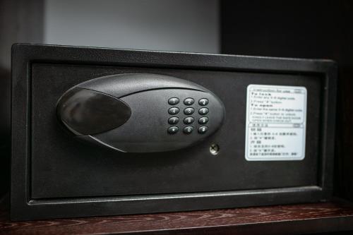 a computer mouse sitting inside of a black microwave at La Renta Hotel & Spa in Hanoi