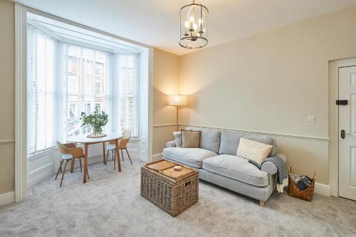 a living room with a couch and a table at Host & Stay - Normanby Terrace Apartments in Whitby