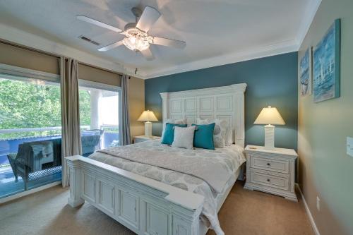 a bedroom with a bed and a ceiling fan at Lake Keowee Condo Resort Pools and Lake Access! in Salem