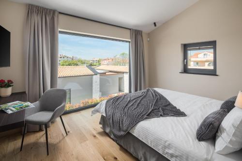 Postel nebo postele na pokoji v ubytování Design Villa Palmeta