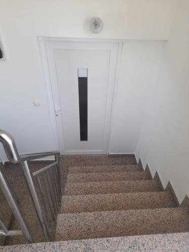 a set of stairs leading up to a door at LUCY Apartments with heated saltwater pool and free private parking in Zadar