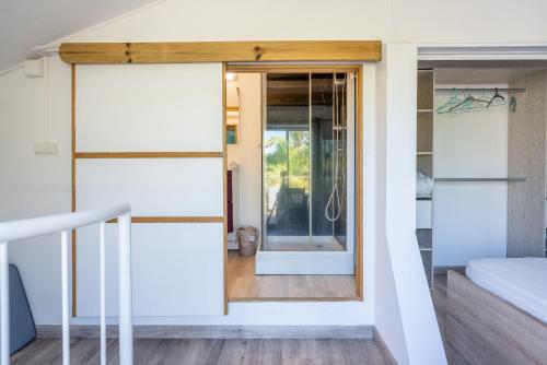 a room with a door leading to a bedroom at Le Sable d'Or in La Saline les Bains