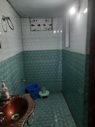 a bathroom with a sink and a toilet at Bhaktikunj Detached 2 room House in Akalkot