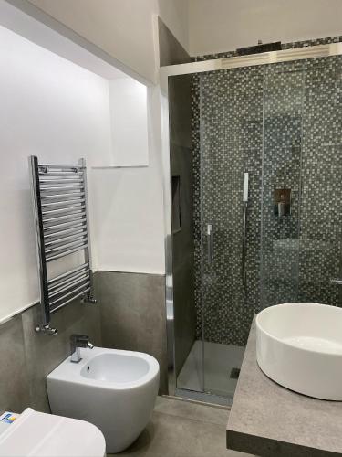 a bathroom with a toilet and a sink and a shower at Casa Wanda - Restyled 2026 Edition Holiday Home, Ischia Center in Ischia Town