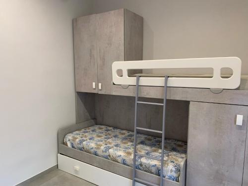 a bunk bed in a small room with a mattress at Casa Wanda - Restyled 2026 Edition Holiday Home, Ischia Center in Ischia Town
