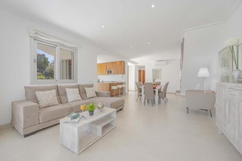a living room with a couch and a table at Villa Cel in Muro