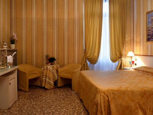 Postel nebo postele na pokoji v ubytování Hotel Corte dei Greci