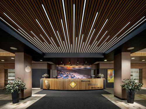 a rendering of a lobby with a large ceiling at Pinia Hotel & Resort in Špindlerův Mlýn
