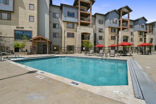 a swimming pool in front of a apartment building at Silverado Lodge by Park City - Canyons Village in Park City