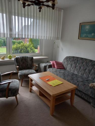 a living room with a couch and a coffee table at Lütke-Dörhoff in Ennigerloh