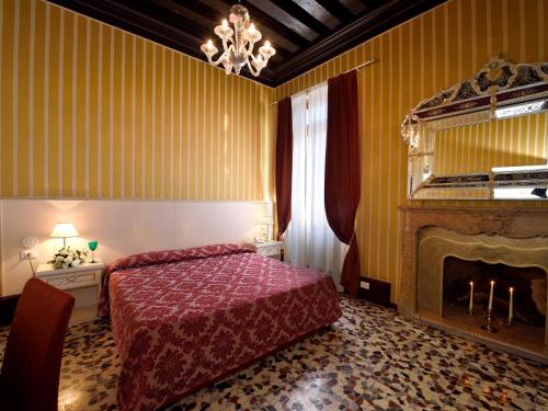 Postel nebo postele na pokoji v ubytování Hotel Corte dei Greci