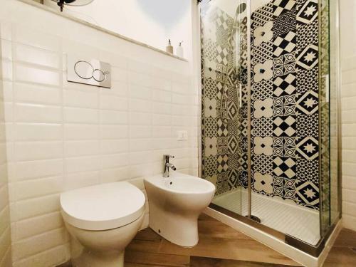 a bathroom with a toilet and a shower at Casa Bella The First in Riomaggiore