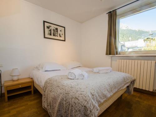 Posteľ alebo postele v izbe v ubytovaní Appartement calme au centre avec terrasse, WiFi, parking - FR-1-343-198