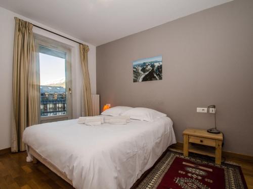 Posteľ alebo postele v izbe v ubytovaní Charmant duplex au cœur de Chamonix avec terrasse, wifi et parking - FR-1-343-183