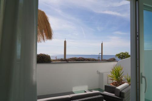 a view of the ocean from the balcony of a house at Hotel Albatros in Ischia