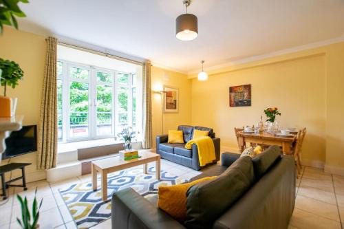 a living room with a couch and a table at City Center 4 Bedroom Townhouse - Sleeps 8 in Galway