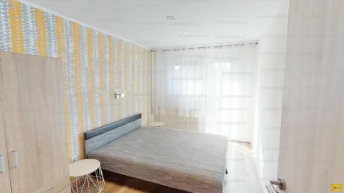 Tempat tidur dalam kamar di Coraline Vendégház