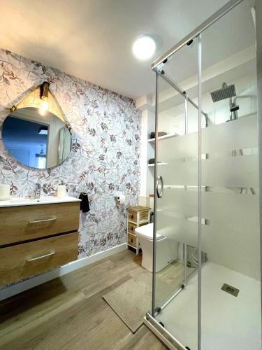 a bathroom with a glass shower stall and a toilet at CASA PLAYA - HOME RENt MALAGA in Torre del Mar