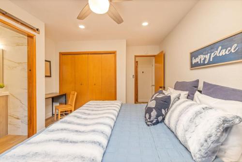 a bedroom with a large bed with pillows on it at Corlieu Falls Cabin in Sugar Pine 8 miles from Yosemite with Gazebo, Hot tub a shack and Bar top in Oakhurst