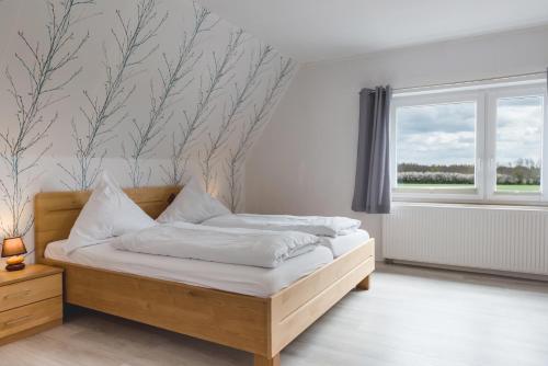 Postel nebo postele na pokoji v ubytování Straendhus Bed&Breakfast