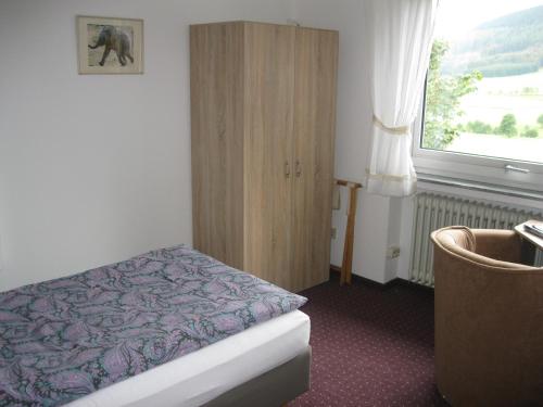 מיטה או מיטות בחדר ב-Jagdhaus Weber
