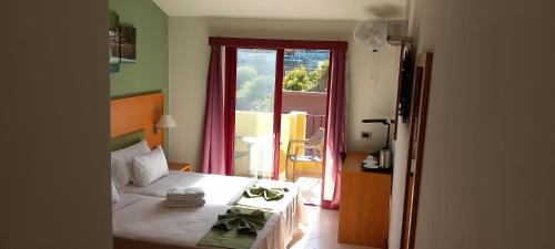 Postel nebo postele na pokoji v ubytování Hotel Belvedere Mindelo, Cabo Verde