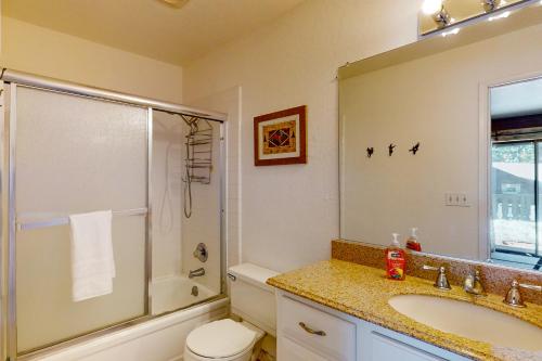 a bathroom with a sink and a shower and a toilet at Beaver Lodge in South Lake Tahoe