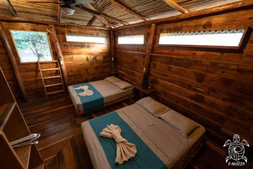 Ένα ή περισσότερα κρεβάτια σε δωμάτιο στο Casa La Aventura Guasacate - Popoyo