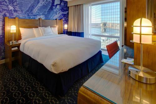 a hotel room with a large bed and a window at Fairfield Inn by Marriott New York Manhattan/Financial District in New York