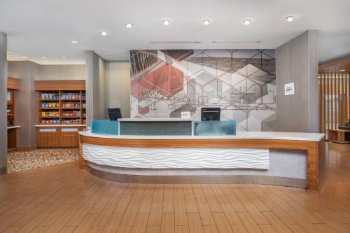 a lobby with a reception desk in a hotel at SpringHill Suites by Marriott Downtown Chattanooga/Cameron Harbor in Chattanooga