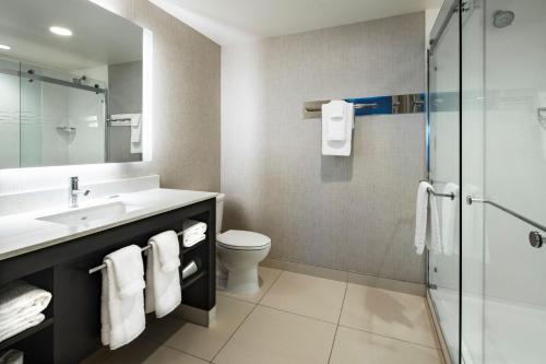 a bathroom with a sink and a toilet and a shower at Residence Inn Las Vegas South/Henderson in Las Vegas