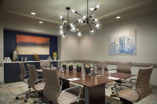a conference room with a table and chairs at Fort Lauderdale Marriott North in Fort Lauderdale