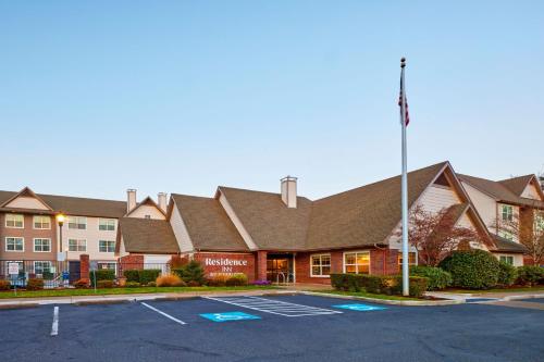 a rendering of the front of a hotel with a parking lot at Residence Inn Eugene Springfield in Eugene