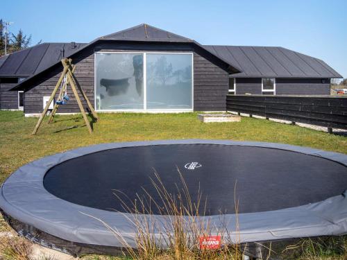a trampoline in front of a house at Luxury Retreat in Vorupor - By Traum Ferienwohnungen in Snedsted