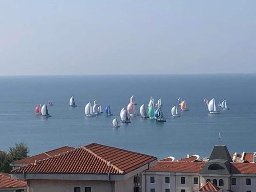 a group of boats in the water with buildings at Smile in Burgas
