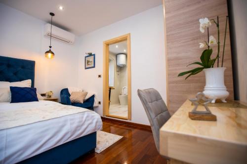 Ένα ή περισσότερα κρεβάτια σε δωμάτιο στο Ideal Rooms #1