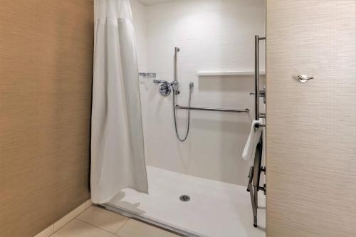 a bathroom with a shower with a shower curtain at Fairfield Inn & Suites by Marriott Boston Marlborough/Apex Center in Marlborough