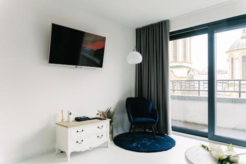 a room with a desk and a chair and a window at Sarajevo Skyline Apartment in Sarajevo
