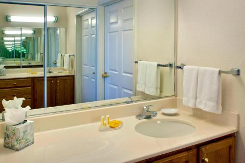 a bathroom with a sink and a large mirror at Residence Inn Boston Andover in Andover
