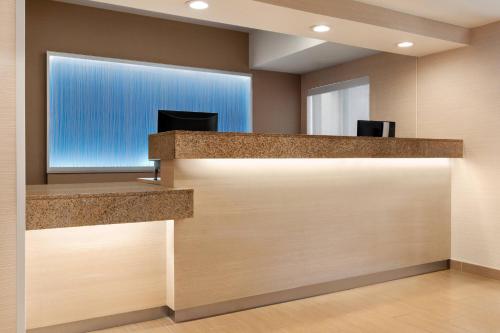 a lobby with a large window and a door at Fairfield Inn Roseville in Roseville
