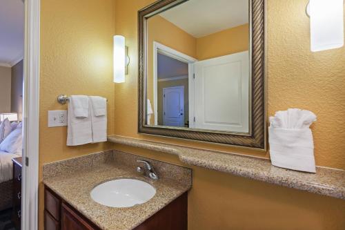 a bathroom with a sink and a mirror at TownePlace Suites by Marriott Odessa in Odessa