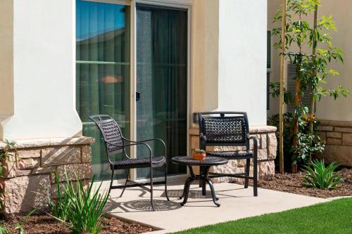 two chairs and a table on a patio at Residence Inn by Marriott Santa Barbara Goleta in Santa Barbara