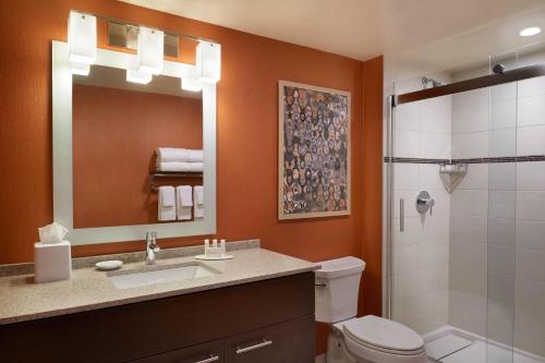 a bathroom with a toilet and a sink and a shower at TownePlace Suites by Marriott Windsor in Windsor