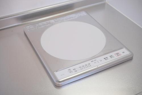 a remote control sitting on top of a table at Rush Awaji - Seaside Holiday Home - Self Check-In Only in Awaji