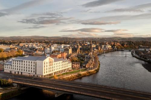 a view of a city with a bridge and a river at AC Hotel by Marriott Inverness in Inverness