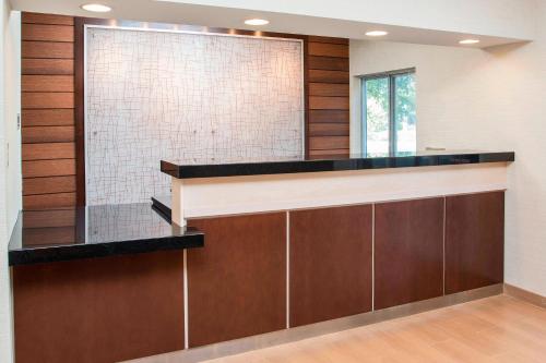 a bar in a bathroom with wood paneling at Fairfield Inn & Suites Peru in Peru